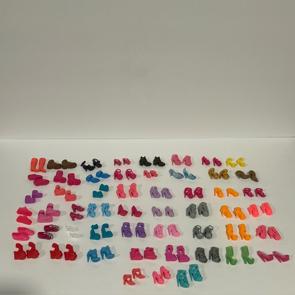 Lot of 53 pairs of Barbie/Barbie type multicolor shoes, heels, boots, wedges +